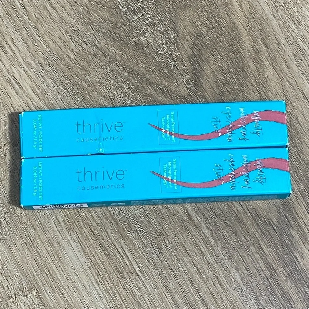 2 Thrive Causemetics Eyeshadow Sticks in Tai warm cranberry matte